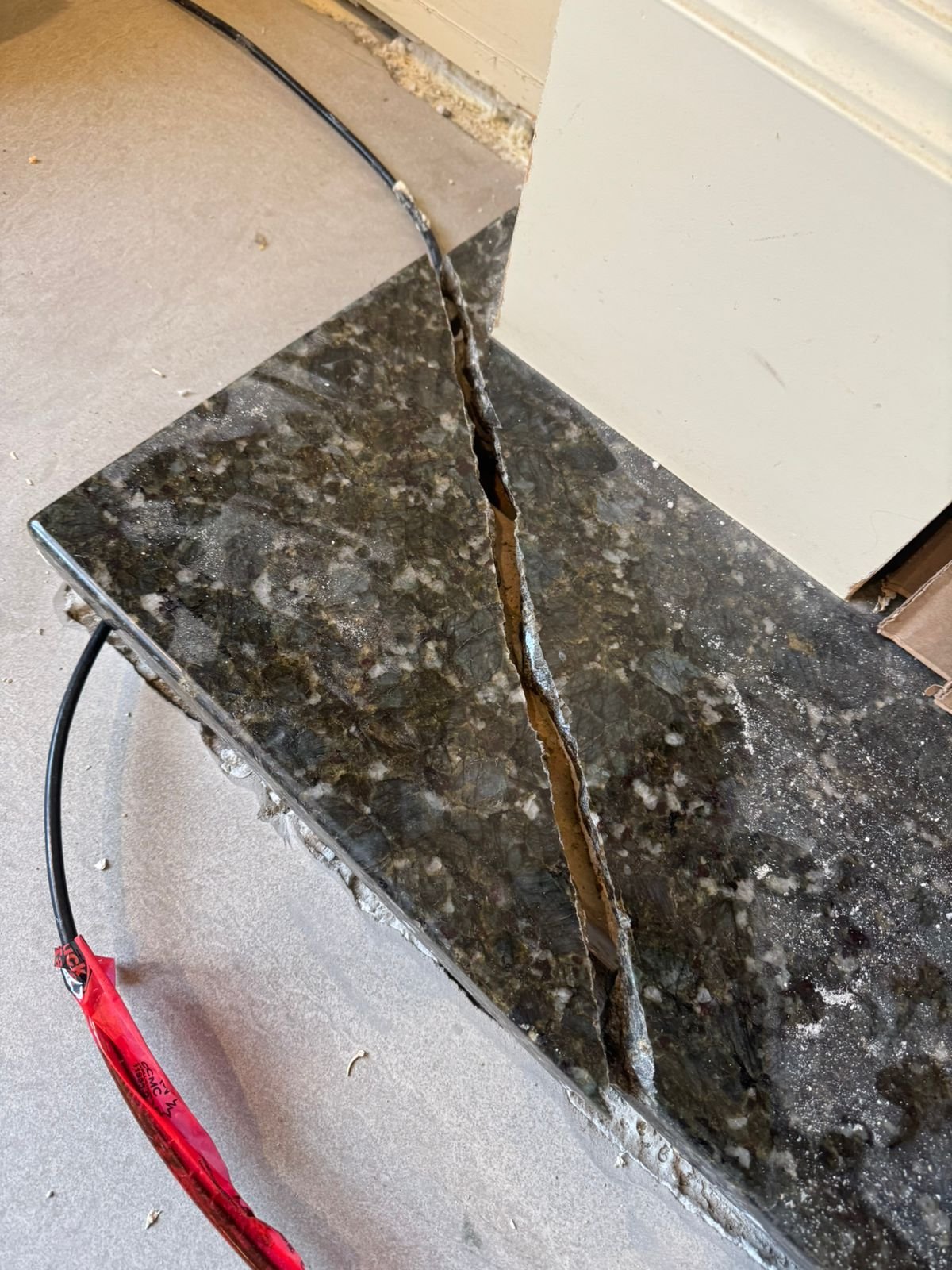 Damaged stone surface before repair